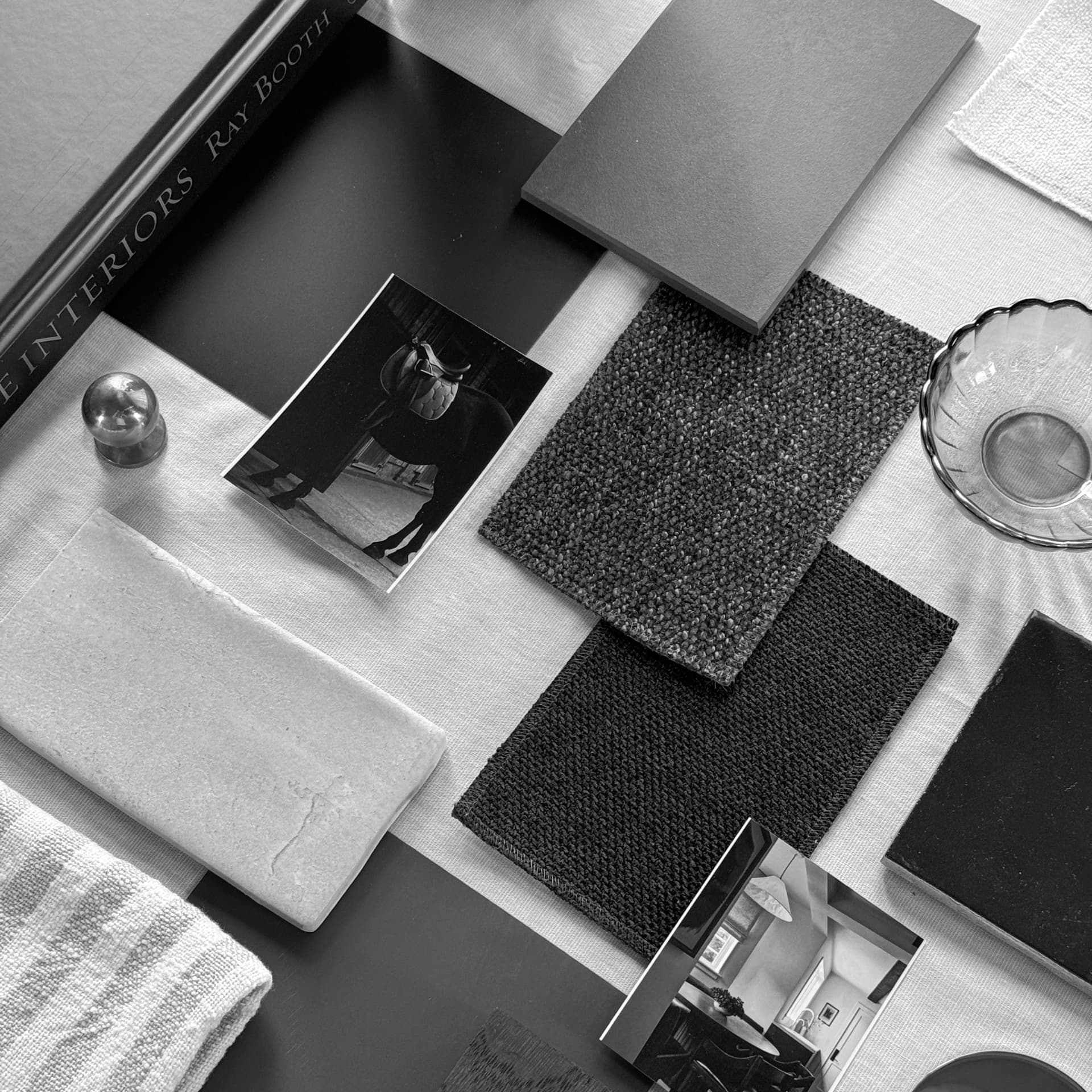 Material samples including fabric, cabinet hardware, and paint for an interior design project
